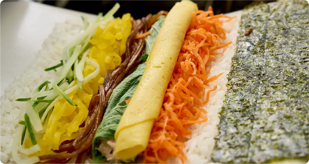Automated kimbap rolling equipment for high-volume restaurant kitchens and catering